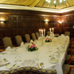 The Oak Room at Mercure York Fairfield Manor Hotel, original oak panelling and draped tented ceiling, chandelier, set up for a meeting