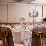 Close up of silver candlestick centrepiece in the Parkside Suite at Mercure York Fairfield Manor Hotel