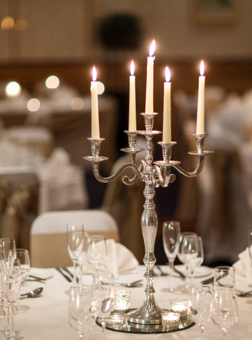 Close up of silver candlestick centrepiece in the Parkside Suite at Mercure York Fairfield Manor Hotel