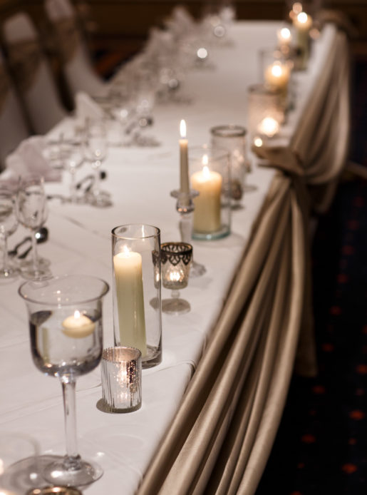 Close up of top table candle decorations at wedding breakfast in the Parkside Suite at Mercure York Fairfield Manor Hotel