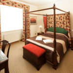 Superior bedroom at Mercure York Fairfield Manor Hotel, large four poster bed