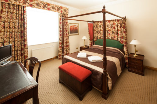 Superior bedroom at Mercure York Fairfield Manor Hotel, large four poster bed